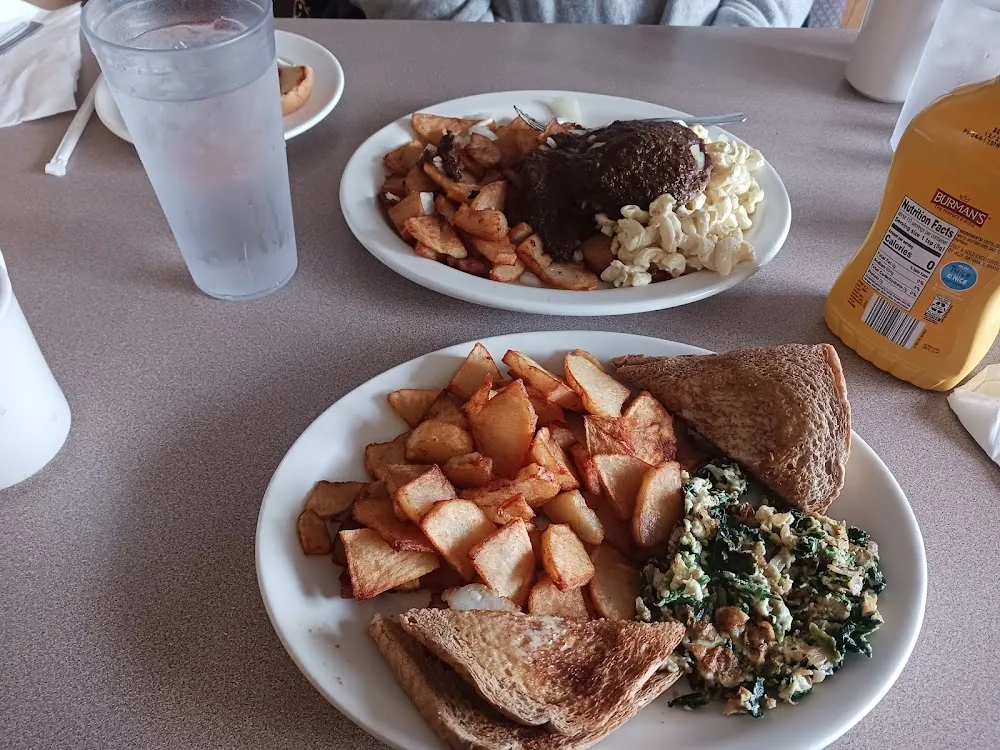 Egg White with Spinach and Onions Along with Deep Fried Home Fries Wheat Toast